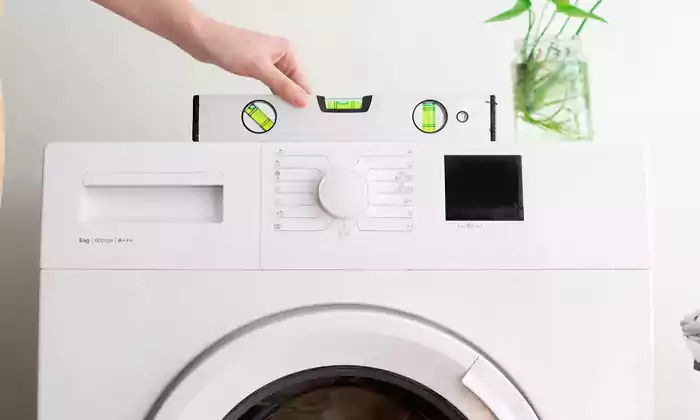 تراز کردن ماشین لباسشویی با ابزار تراز